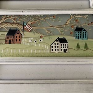 Window plaque featuring New England village, black chain for hanging.